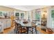 Charming dining room with oval table and hardwood floors at 412 E Hudson Ave, Folly Beach, SC 29439