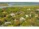 Aerial view of houses and lush greenery near the water at 412 E Hudson Ave, Folly Beach, SC 29439