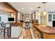 Rustic kitchen with butcher block countertops, stainless steel appliances, and ample cabinetry at 412 E Hudson Ave, Folly Beach, SC 29439