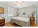 Spacious bedroom with king-size bed and hardwood floors at 412 E Hudson Ave, Folly Beach, SC 29439