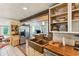 Modern farmhouse kitchen with copper farm sink, ample counter space, and open shelving at 412 E Hudson Ave, Folly Beach, SC 29439