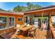 Relaxing deck with seating, dining, and a hammock at 412 E Hudson Ave, Folly Beach, SC 29439