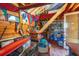 Small studio with wooden walls, eclectic decor, and storage shelving at 412 E Hudson Ave, Folly Beach, SC 29439
