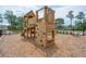 Wooden playground structure with climbing wall and slide at 1687 Cultivation Ln # 461, Mount Pleasant, SC 29466