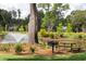 Relaxing park with pond, picnic tables, grill, and lush greenery at 1687 Cultivation Ln # 461, Mount Pleasant, SC 29466