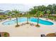 Resort-style pool with lounge chairs and palm trees at 1687 Cultivation Ln # 461, Mount Pleasant, SC 29466