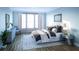 Bright bedroom with large windows, plush bedding, and stylish furnishings at 1687 Cultivation Ln # 461, Mount Pleasant, SC 29466