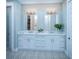 Spa-like bathroom with double vanity, patterned flooring, and elegant lighting at 1687 Cultivation Ln # 461, Mount Pleasant, SC 29466