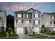 Two-story home with light blue siding, white trim, and a two-car garage at 1687 Cultivation Ln # 461, Mount Pleasant, SC 29466