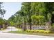 Gated entrance to Liberty Hill Farm community with lush landscaping and palm trees at 1687 Cultivation Ln # 461, Mount Pleasant, SC 29466