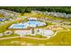 Aerial view of community pool, playground, and surrounding homes at 530 Golden Embers Way, Summerville, SC 29486