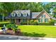 Brick home with green shutters and landscaped yard at 10 Trail Hollow Dr, Charleston, SC 29414
