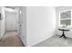 Long hallway with carpet and neutral walls at 10 Trail Hollow Dr, Charleston, SC 29414
