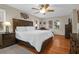 Bright bedroom with hardwood floors and king-size bed at 10 Trail Hollow Dr, Charleston, SC 29414