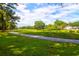 Stunning golf course view with lush green fairways and mature trees at 10 Trail Hollow Dr, Charleston, SC 29414