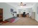 Spacious home office with built-in shelving, carpet, and a treadmill at 10 Trail Hollow Dr, Charleston, SC 29414