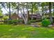 Brick house exterior with screened porch and lush landscaping at 10 Trail Hollow Dr, Charleston, SC 29414