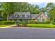 Brick home with gray roof, green shutters, and lush landscaping at 10 Trail Hollow Dr, Charleston, SC 29414