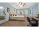 Bright bedroom with a comfortable bed, built-in desk and large windows at 10 Trail Hollow Dr, Charleston, SC 29414