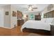 Main bedroom with hardwood floors and a king-size bed at 10 Trail Hollow Dr, Charleston, SC 29414