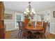 Formal dining room with hardwood floors, an oval table, and chandelier at 10 Trail Hollow Dr, Charleston, SC 29414