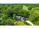 Brick house with gray roof and landscaped yard near golf course at 10 Trail Hollow Dr, Charleston, SC 29414