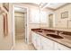 Double vanity bathroom with dark countertop and shower at 10 Trail Hollow Dr, Charleston, SC 29414