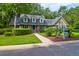 Brick house with gray roof, green shutters, and manicured lawn at 10 Trail Hollow Dr, Charleston, SC 29414