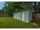 White storage shed in the backyard at 133 Marion Rd, Summerville, SC 29486