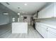 Modern kitchen with white cabinets, quartz countertops, and large island at 133 Marion Rd, Summerville, SC 29486