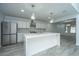 Modern kitchen with white cabinets, quartz countertops, and stainless steel appliances at 133 Marion Rd, Summerville, SC 29486