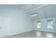 Open dining room with gray vinyl floors and a modern chandelier at 133 Marion Rd, Summerville, SC 29486