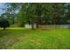 Large backyard with storage shed and fenced perimeter at 133 Marion Rd, Summerville, SC 29486