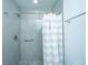 Bathroom with shower, gray tile, and white striped shower curtain at 133 Marion Rd, Summerville, SC 29486