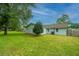 Large backyard with green grass and a wooden fence at 133 Marion Rd, Summerville, SC 29486