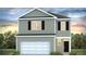 Two-story house with gray siding, white trim, and a two-car garage at 2172 Macallan Blvd, Ravenel, SC 29470