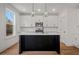 Modern kitchen with white cabinets, quartz countertops, and a large island at 423 Grove End Rd, Moncks Corner, SC 29461