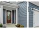 Dark wood front door with glass panels at 423 Grove End Rd, Moncks Corner, SC 29461
