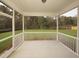 Spacious screened porch overlooking a backyard at 423 Grove End Rd, Moncks Corner, SC 29461