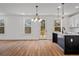 Modern kitchen with island and access to deck at 423 Grove End Rd, Moncks Corner, SC 29461