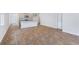 Open living space with wood-look floors and access to the kitchen at 5536 Bowmore Blvd, Ravenel, SC 29470