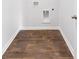 Laundry room with wood-look floors and hookups for washer and dryer at 5536 Bowmore Blvd, Ravenel, SC 29470