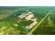 Aerial view of a new home community with lots and surrounding natural landscape at 5536 Bowmore Blvd, Ravenel, SC 29470