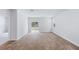 Bright living room with wood-look floors and sliding glass doors to backyard at 5536 Bowmore Blvd, Ravenel, SC 29470