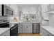 Modern kitchen with stainless steel appliances and view to the living room at 1239 Creek Watch, Seabrook Island, SC 29455