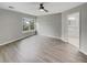 Bedroom featuring ceiling fan, laminate floor, and en-suite bathroom at 119 Mockernut Dr, Ladson, SC 29456