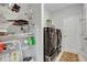 Laundry room with washer, dryer, and ample shelving for storage at 516 Yellow Leaf Ln, Summerville, SC 29486