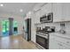 Eat-in kitchen with stainless steel appliances and access to backyard at 516 Yellow Leaf Ln, Summerville, SC 29486