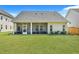 Large backyard with screened porch and green lawn at 516 Yellow Leaf Ln, Summerville, SC 29486