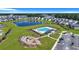 Aerial view of community features including pool, playground, pond, and homes at 516 Yellow Leaf Ln, Summerville, SC 29486